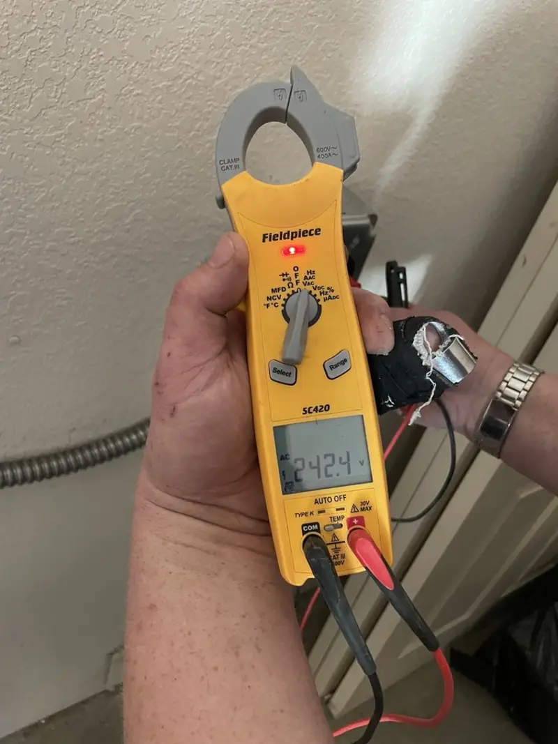 Voltage testing with clamp meter during Outlet Installation in Pass Christian